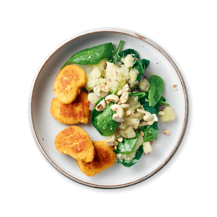 Vegetarische nuggets met spinaziepuree en cashewnoten