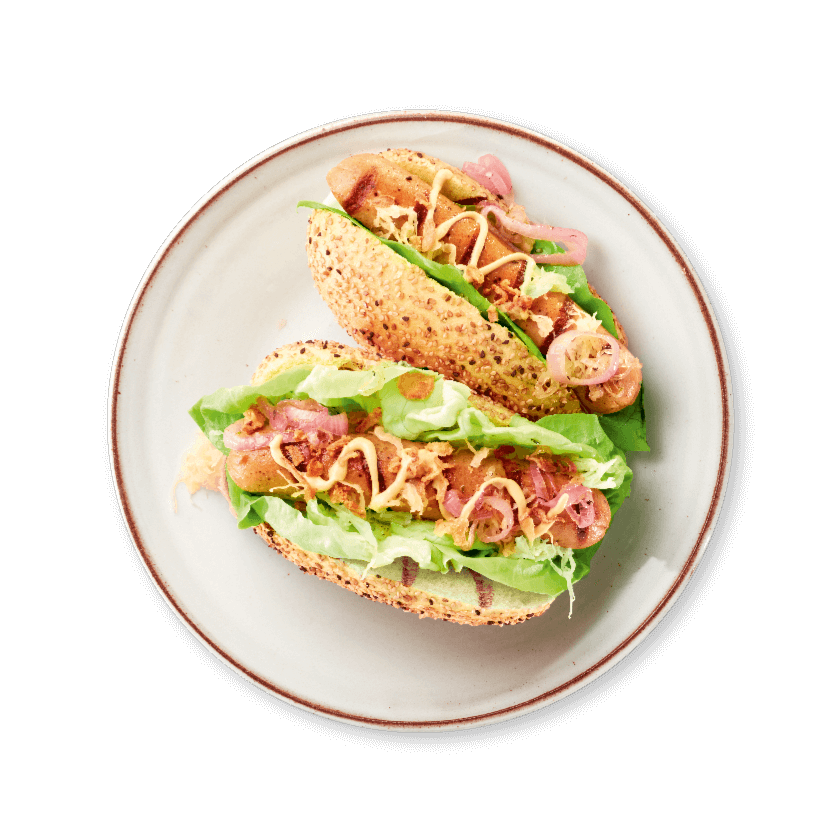Duitse hotdog met veggie braadworst, zuurkool en gekaramelliseerde ui